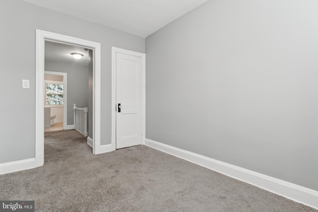 unfurnished bedroom with light colored carpet