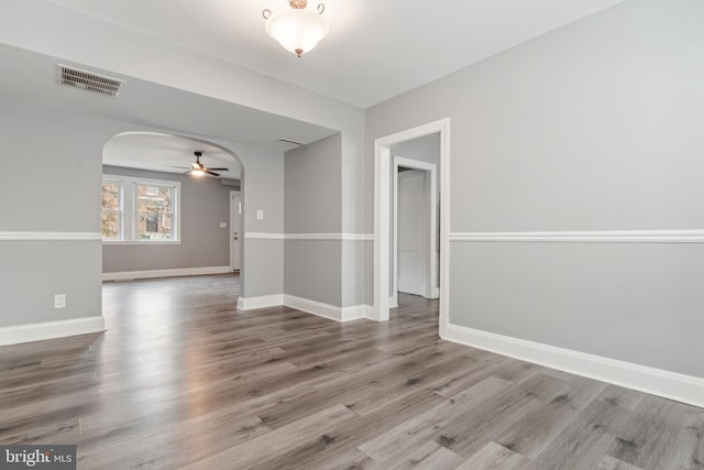 unfurnished room featuring hardwood / wood-style flooring and ceiling fan