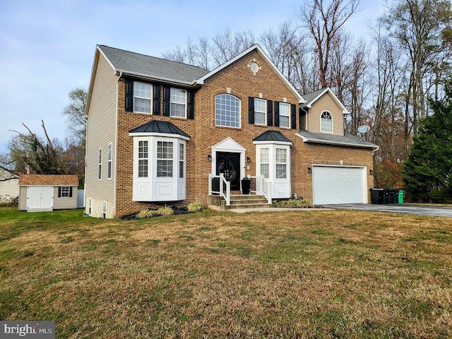 view of front facade featuring a front yard and a garage