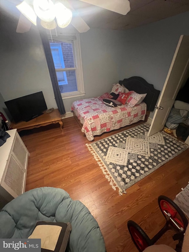 bedroom featuring ceiling fan and light wood-type flooring