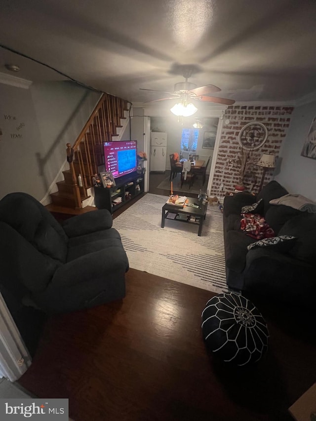 living room with hardwood / wood-style floors and ceiling fan