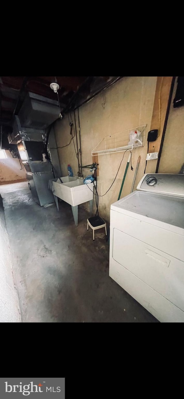 6412 Akron St, Philadelphia, PA 19149 - unfinished basement featuring washer / clothes dryer
