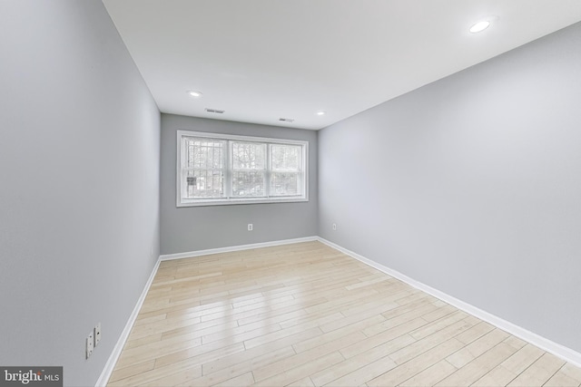 spare room with light hardwood / wood-style flooring