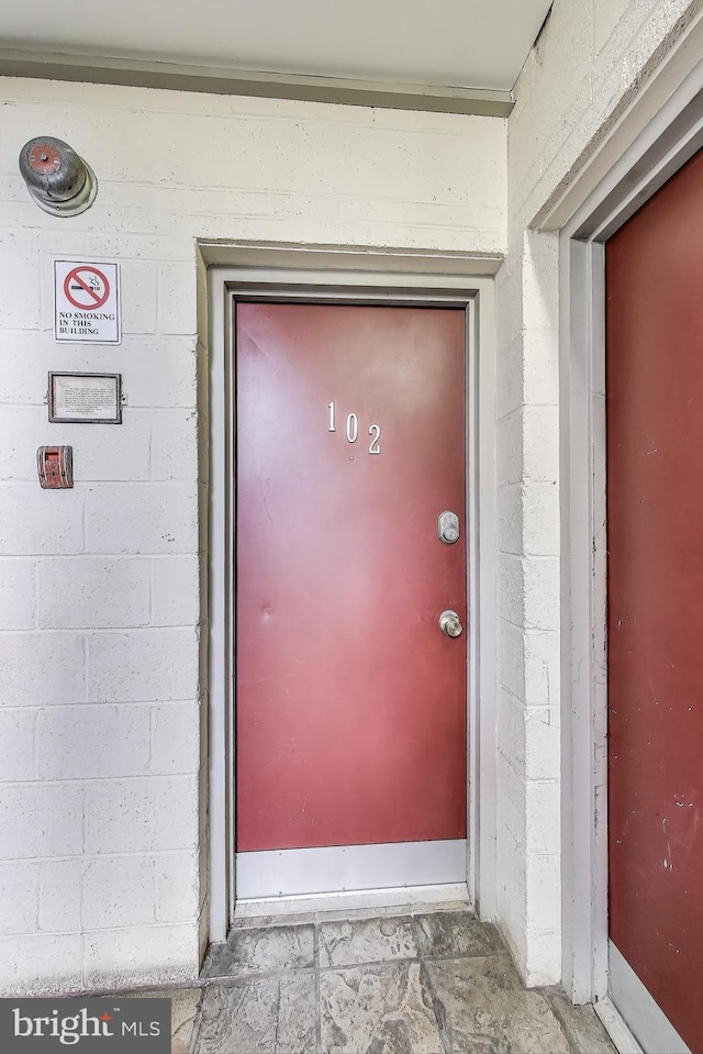 5045 Call Pl SE Unit 102, Washington, DC 20019 - view of exterior entry with concrete block siding