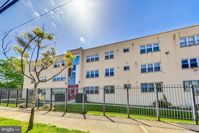 5045 Call Pl SE Unit 102, Washington, DC 20019 - view of building exterior with a fenced front yard