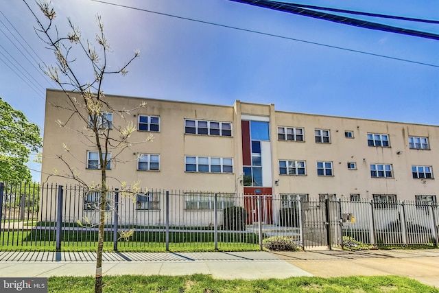 5045 Call Pl SE Unit 102, Washington, DC 20019 - view of building exterior with a fenced front yard