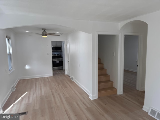 unfurnished room featuring ceiling fan and light hardwood / wood-style floors