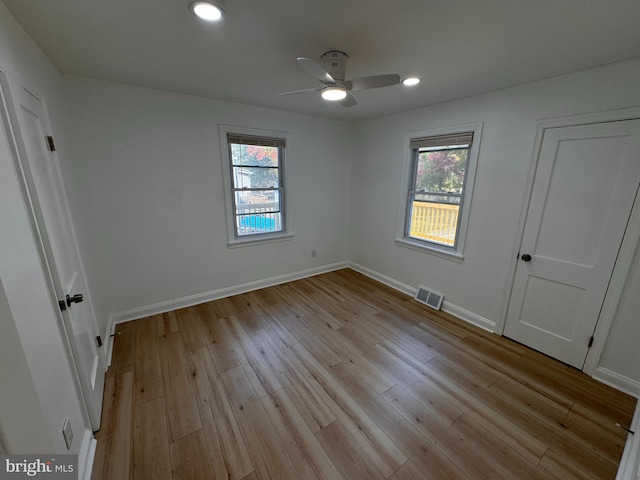 unfurnished bedroom featuring light wood-type flooring and ceiling fan