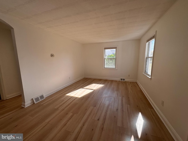 unfurnished room featuring light hardwood / wood-style flooring