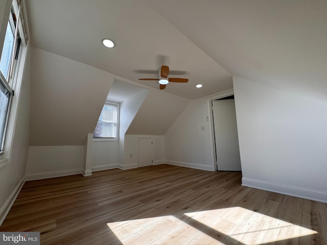 bonus room featuring ceiling fan, vaulted ceiling, and light hardwood / wood-style flooring