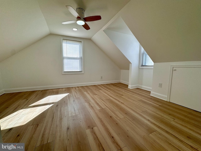 bonus room with ceiling fan, light hardwood / wood-style flooring, and lofted ceiling