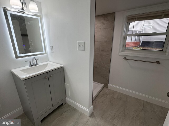 bathroom with vanity and walk in shower