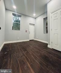 interior space with dark hardwood / wood-style floors