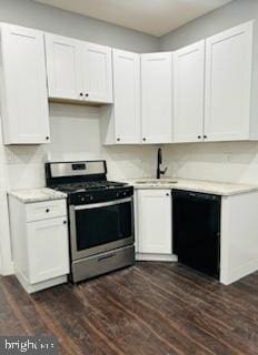 kitchen featuring stainless steel gas stove, dark hardwood / wood-style flooring, dishwasher, and white cabinetry