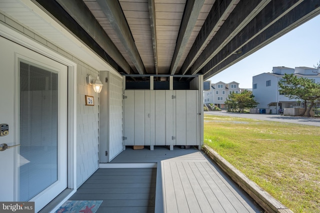 wooden deck with a lawn