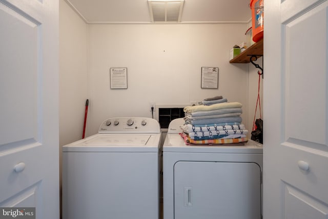 laundry area featuring washing machine and clothes dryer