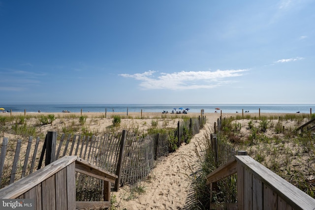 view of water feature with a beach view