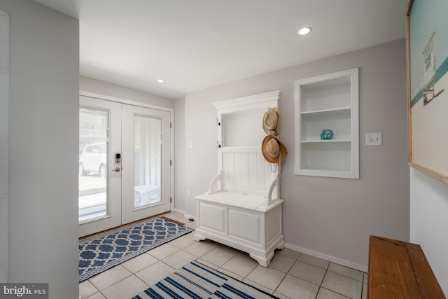 mudroom with light tile patterned floors and french doors