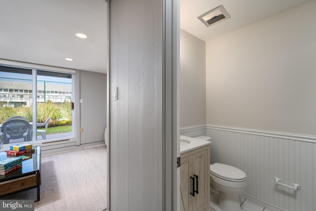 bathroom featuring vanity and toilet