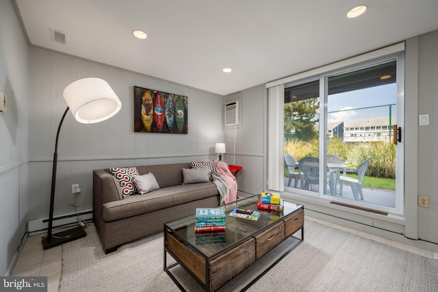 tiled living room featuring a baseboard heating unit