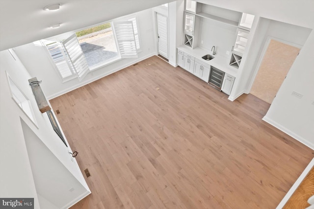 unfurnished living room with light hardwood / wood-style flooring