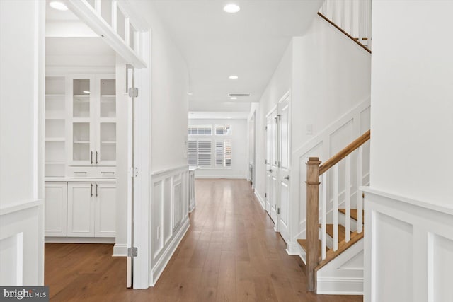 hallway with hardwood / wood-style floors