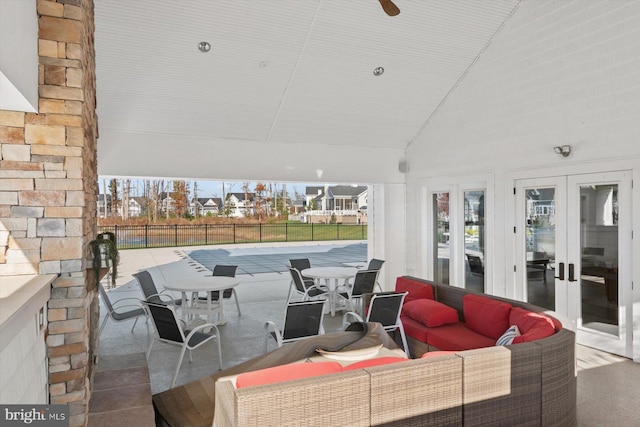 view of patio / terrace featuring outdoor lounge area, french doors, and a swimming pool