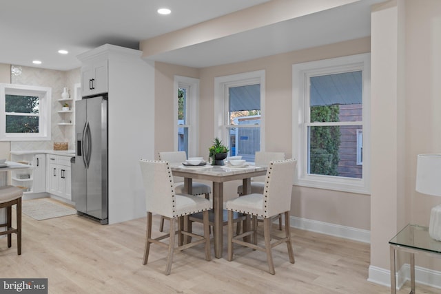 dining area featuring light wood-type flooring