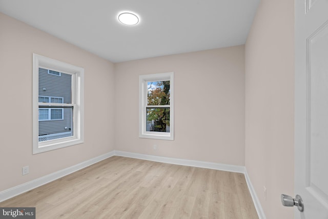 unfurnished room featuring light hardwood / wood-style flooring