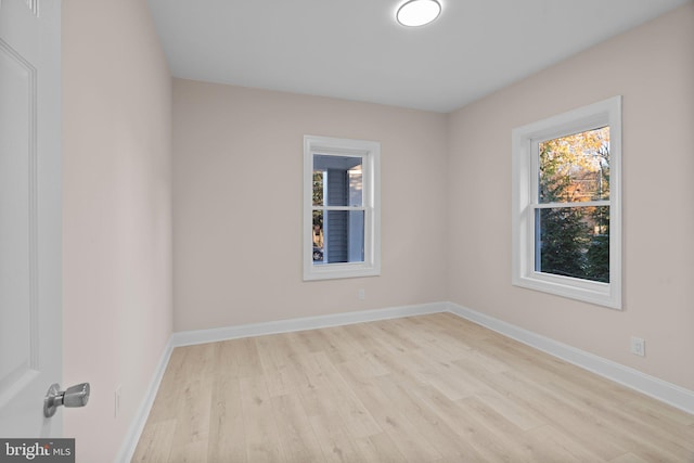 unfurnished room featuring light hardwood / wood-style floors