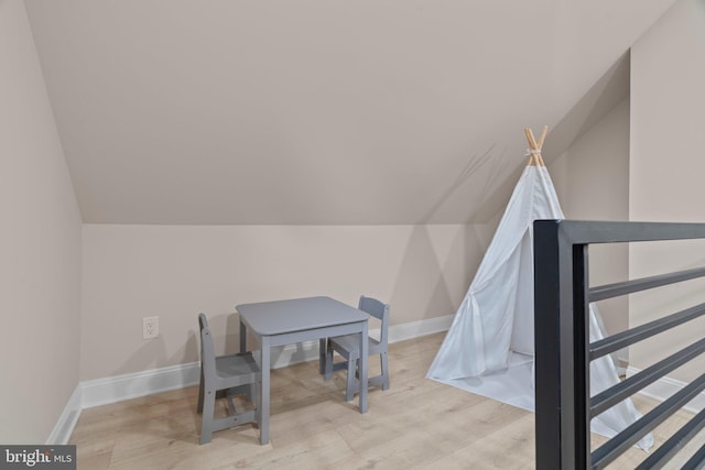 interior space with lofted ceiling and light wood-type flooring