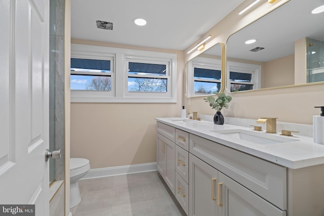 bathroom with vanity and toilet