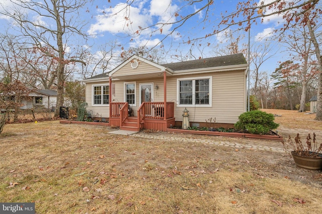 ranch-style home with a front yard