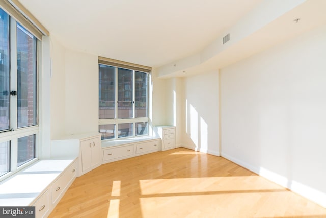 unfurnished living room with light hardwood / wood-style flooring