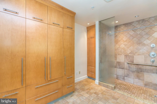 bathroom with tiled shower