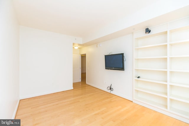 empty room with hardwood / wood-style floors