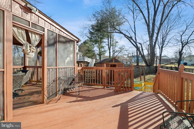 wooden terrace featuring a sunroom