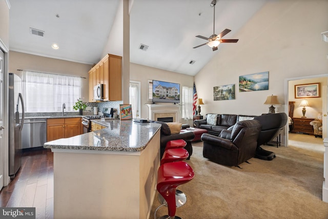 kitchen featuring open floor plan, visible vents, and appliances with stainless steel finishes