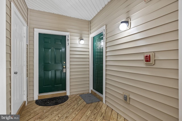 doorway to property featuring covered porch