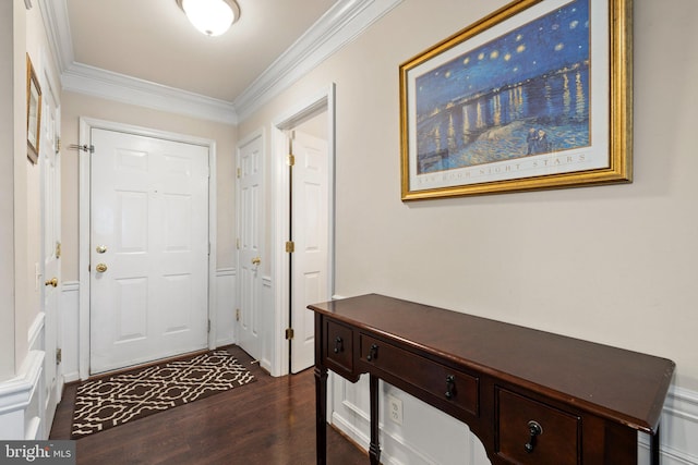 entrance foyer featuring crown molding and dark wood-style floors