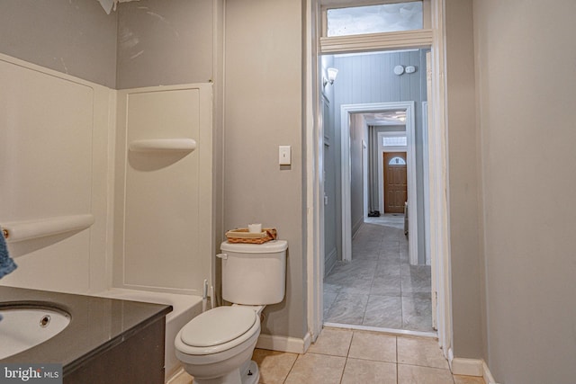 bathroom with tile patterned floors, vanity, and toilet