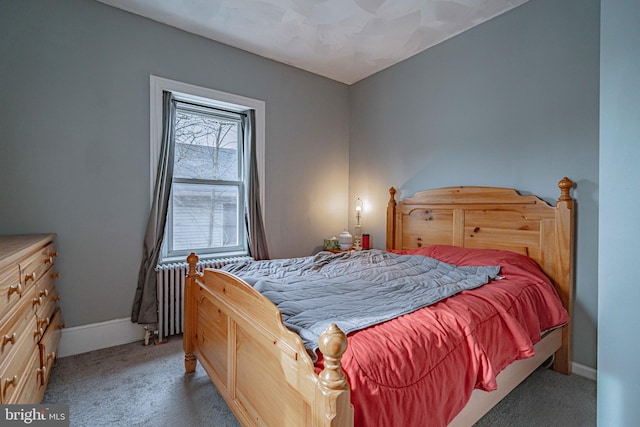 bedroom featuring carpet floors and radiator