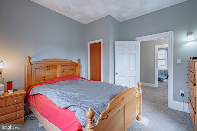 bedroom with light carpet