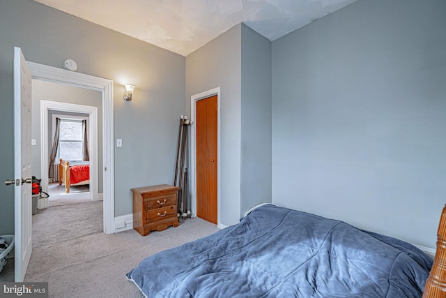 bedroom featuring light colored carpet