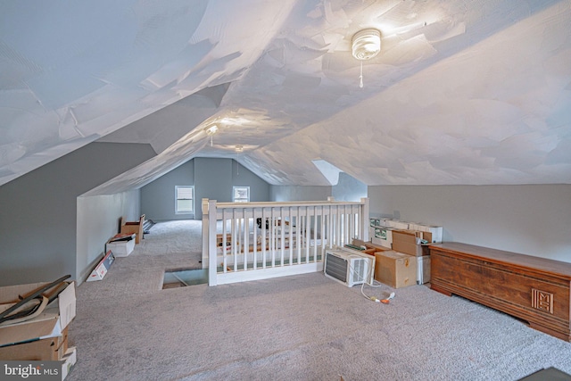 carpeted bedroom featuring lofted ceiling