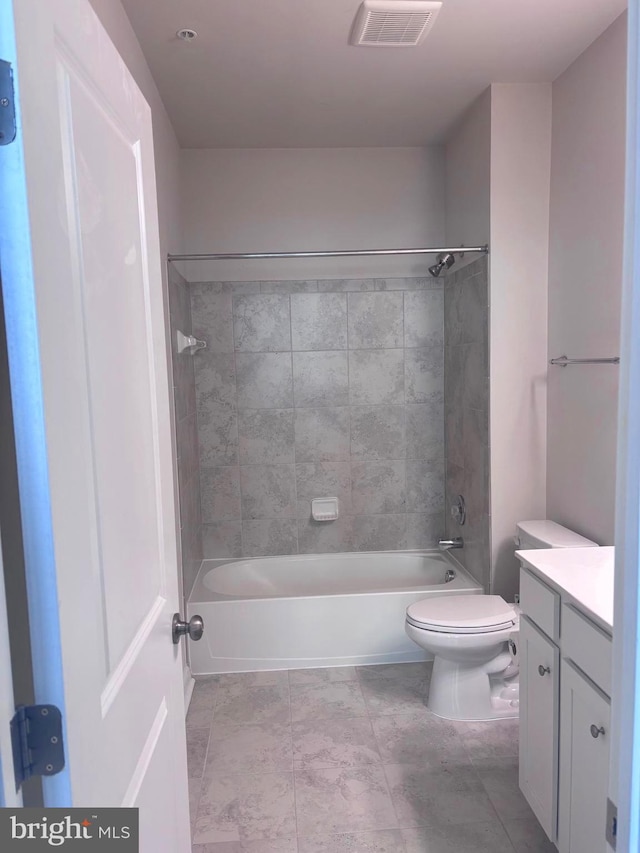 full bathroom with vanity, toilet, and tiled shower / bath