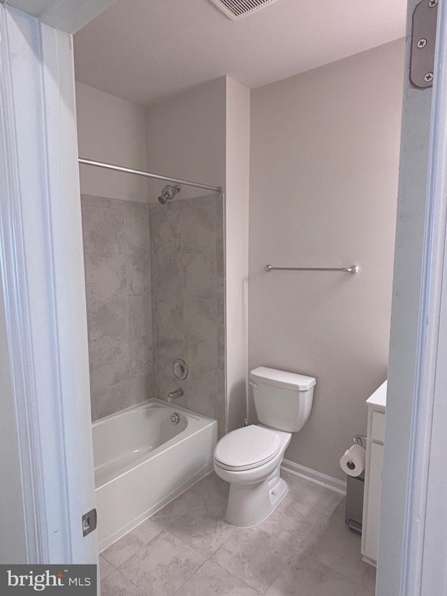 full bathroom with vanity, tiled shower / bath combo, and toilet