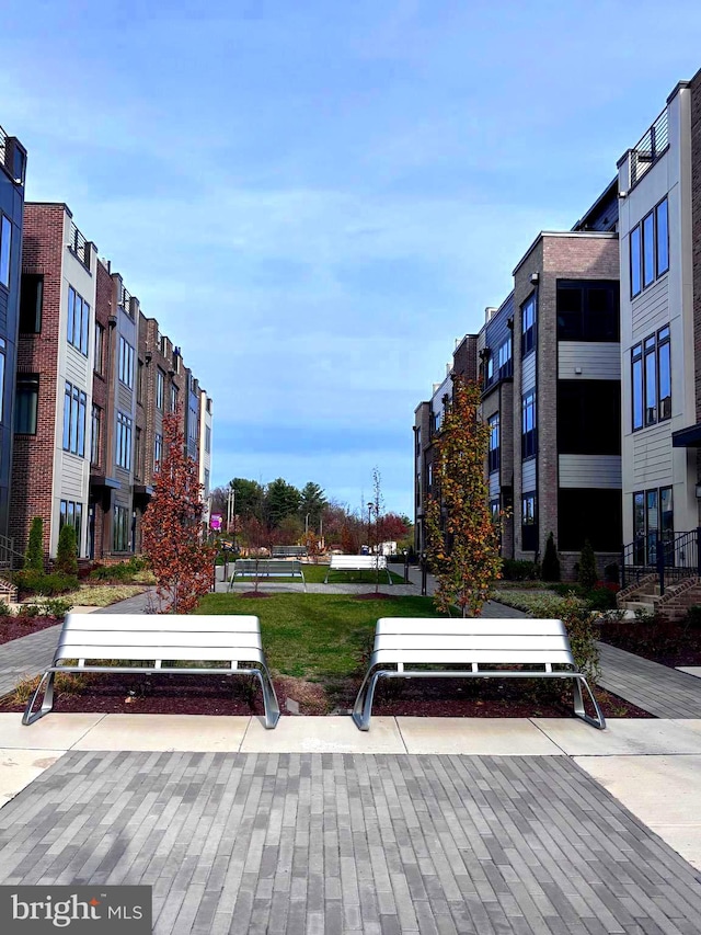 view of home's community featuring a lawn