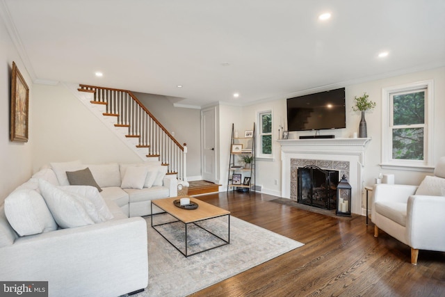 living room with crown molding and dark hardwood / wood-style flooring