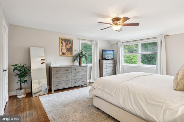 bedroom featuring ceiling fan and dark wood-type flooring